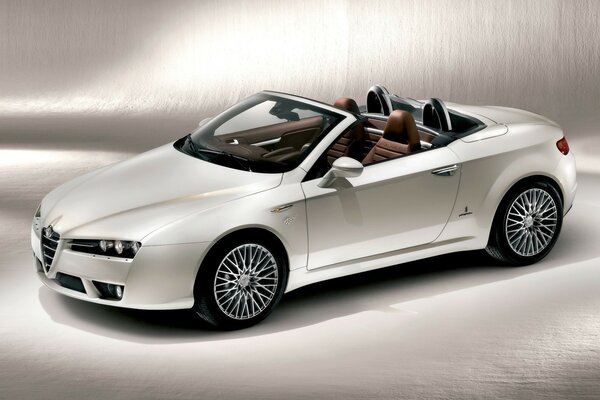 White alfa Romeo convertible with a cinnamon interior