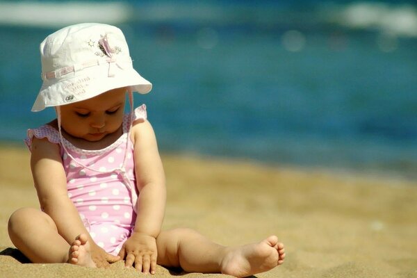 A child in panama plays on the beach