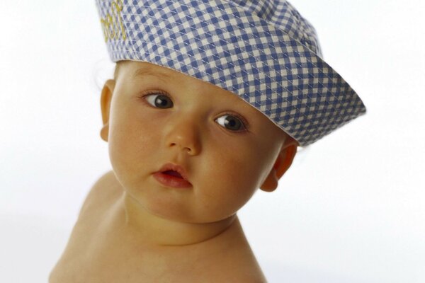 Cute baby in a plaid panama hat