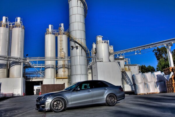 Beautiful car on the background of the factory