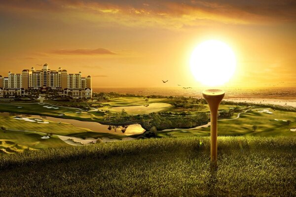 Golfe contra a cidade e o pôr do sol