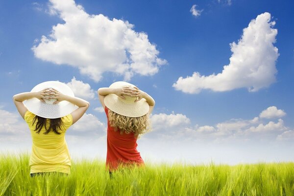 Children on a bright, sunny day look at the sky