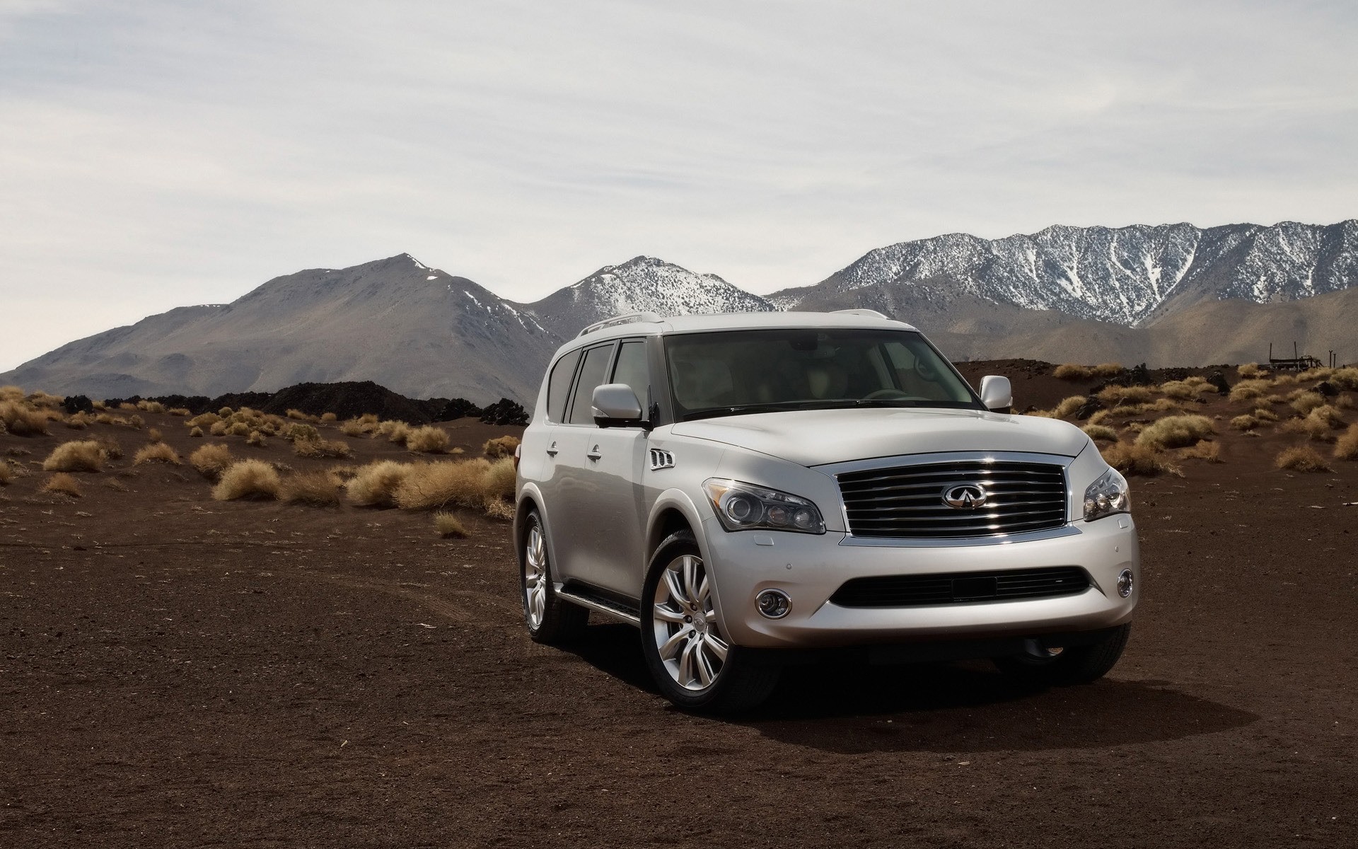 infiniti car vehicle travel mountain desert landscape snow transportation system noon road mustang sky infiniti qx