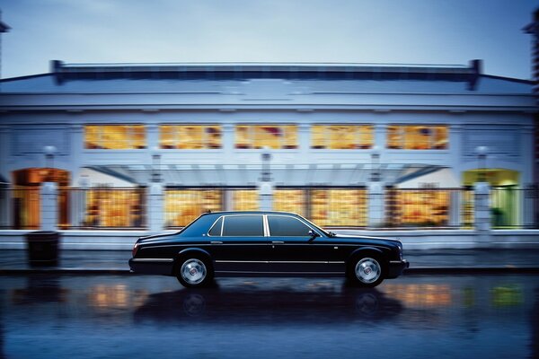 Bentley on the street of the evening city