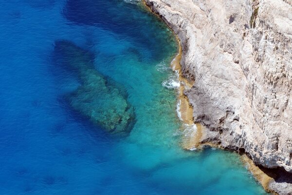 Blue water at the foot of the cliffs