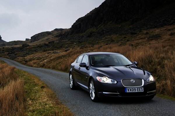 A comfortable car passing a narrow road