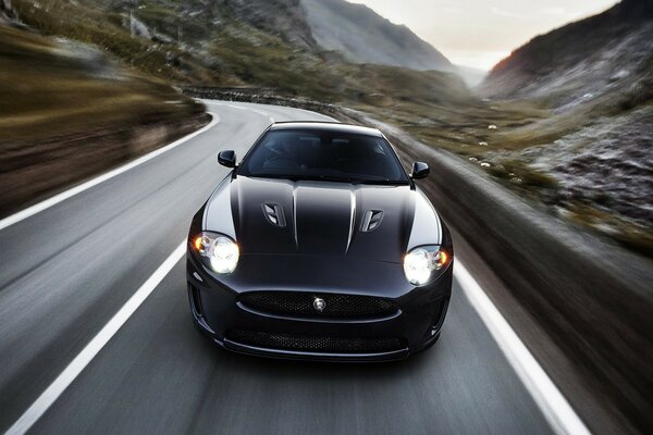 A gorgeous car rides among a mountain gorge