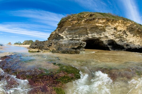 The rocky shore of the transparent sea