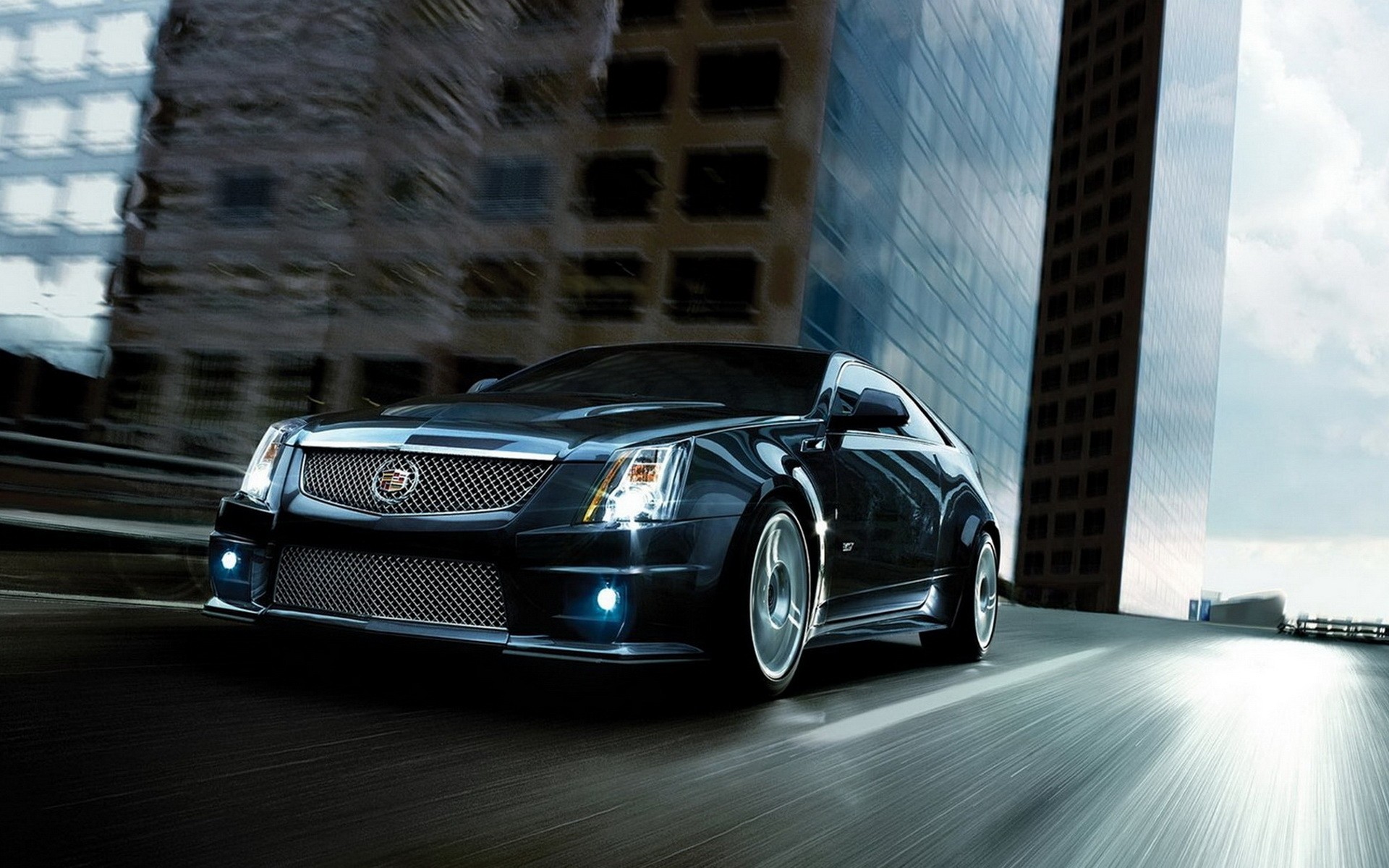 cadillac car vehicle transportation system street pavement road city blur travel fast automotive cars