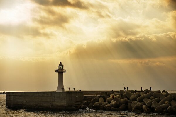 Landscape lighthouse at sunset calm