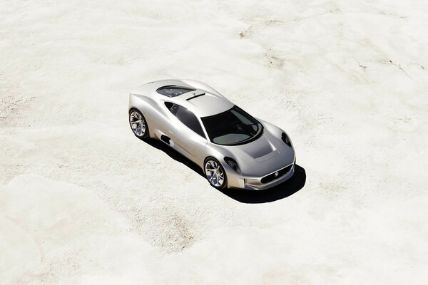 Luxury car on white sand