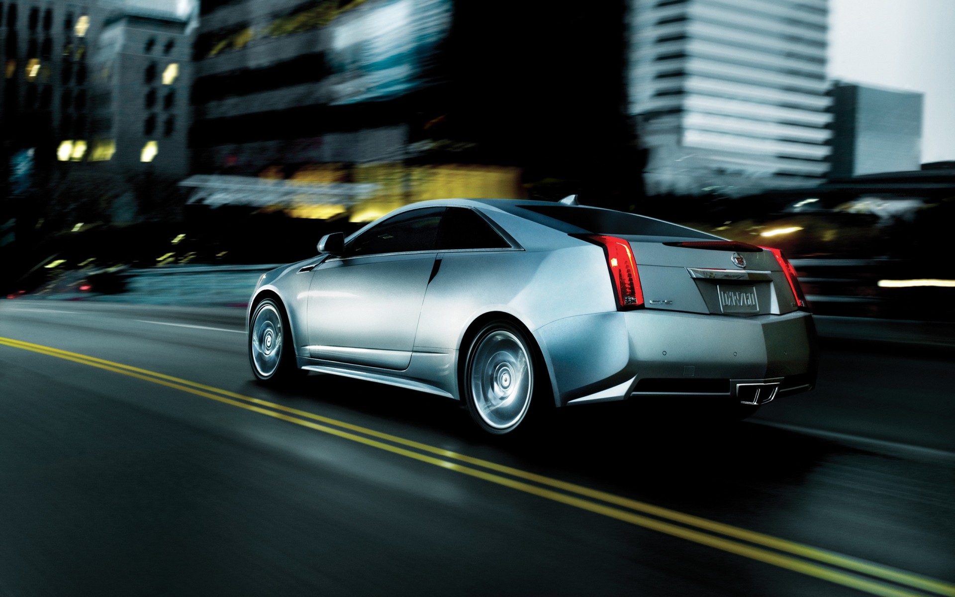 cadillac car blur vehicle blacktop pavement asphalt action transportation system fast hurry road automotive cadillac cts