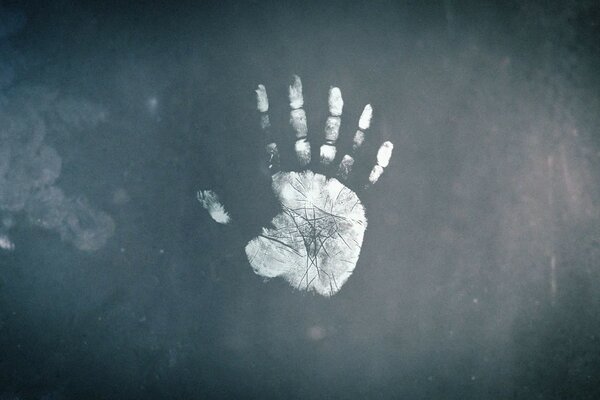 A handprint on a blackboard