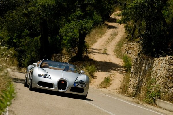 Bugatti brand car rides on asphalt