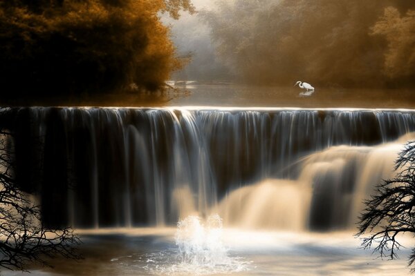 Autumn landscape with a small waterfall