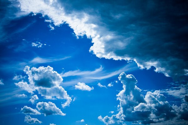 Bright blue sky. Clouds are gathering