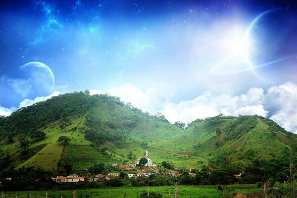 Green hills. Houses at the foot of the hills. Planets in the sky. Magnificent landscape