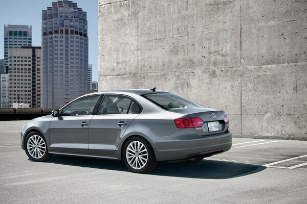 Gray volkswagen in the stone jungle of the city