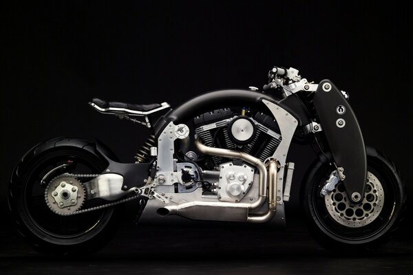 The bike is chrome-plated on a black background