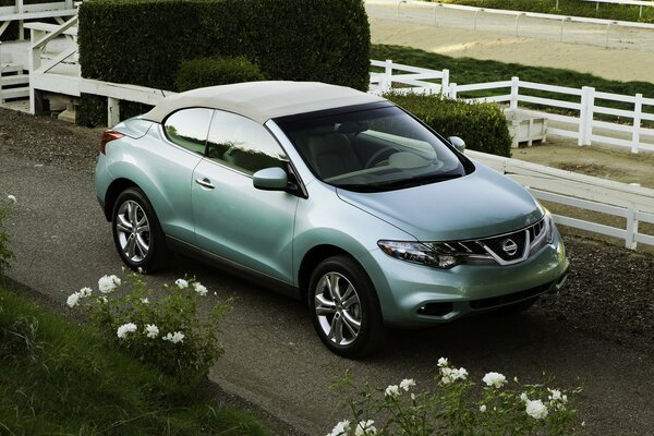 Nissan with a folding roof on the road