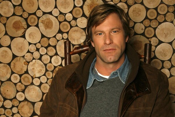 Cute man on a wooden background