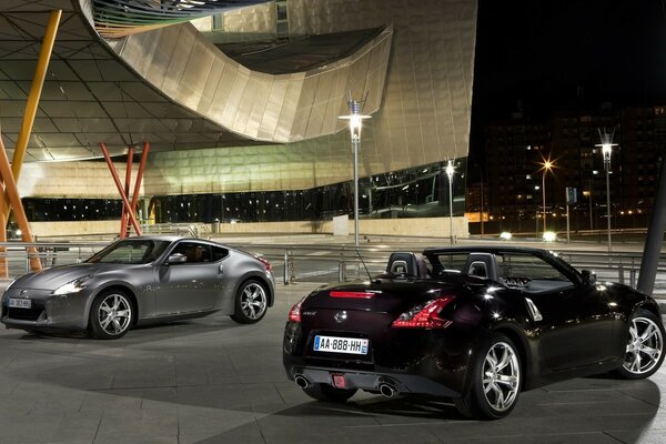 Gray and black nissan cars