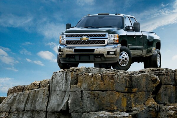 Large SUV on a rocky cliff