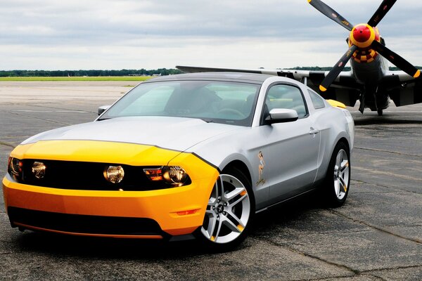 A car on the background of an airplane propeller