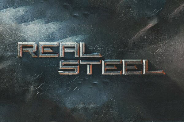 Sobre un fondo gris, las palabras en Inglés Real Steel