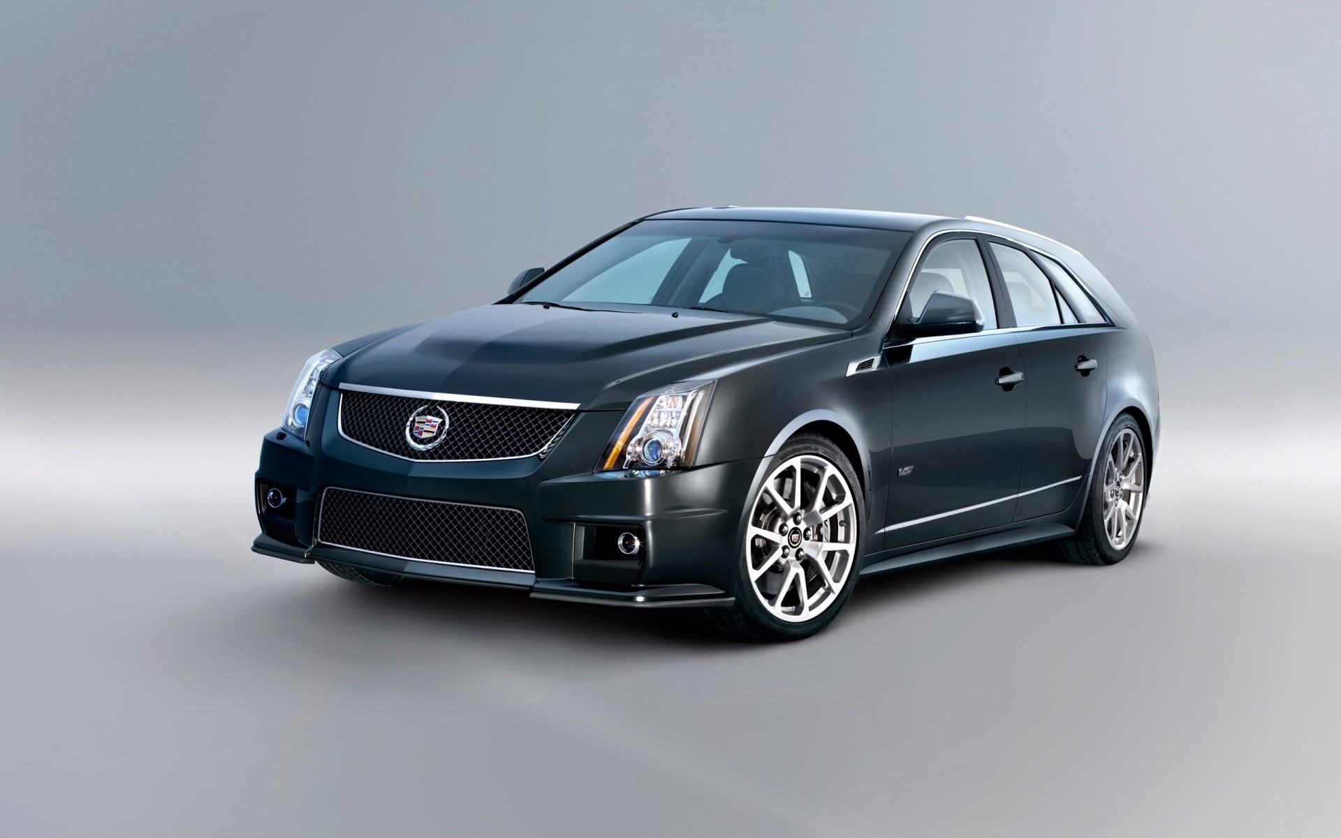 cadillac car vehicle blacktop wheel noon automotive coupe pavement sedan asphalt fast cadillac cts