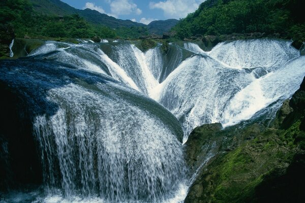 Mountain landscape with large waterfalls