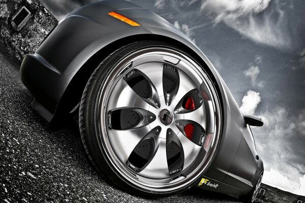 Chevrolet wheel on asphalt against the sky