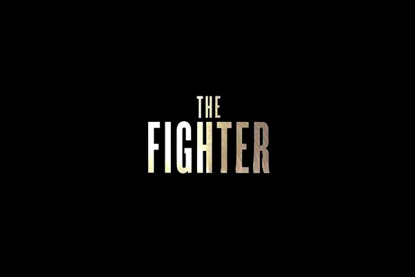 Inscription The fighter sur fond noir