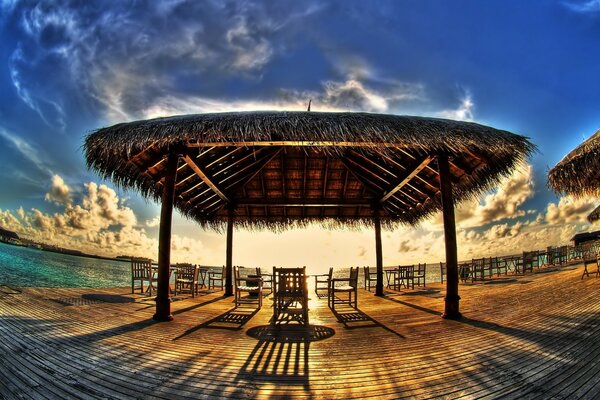 Summer veranda on the beach by the water