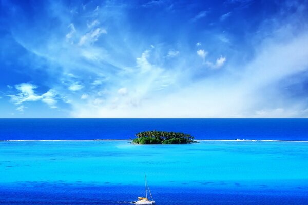 Tropical landscape of the island and the ship