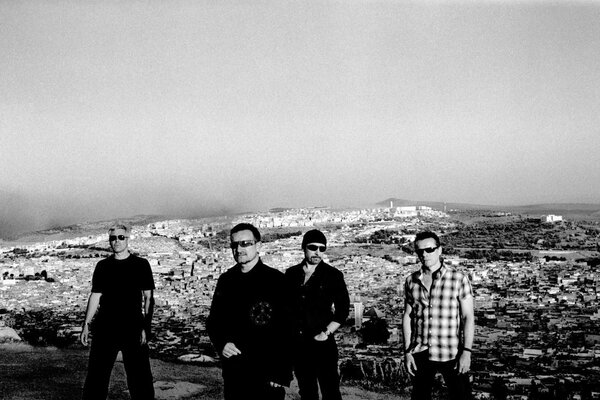 Street photo of men on the background of mountains