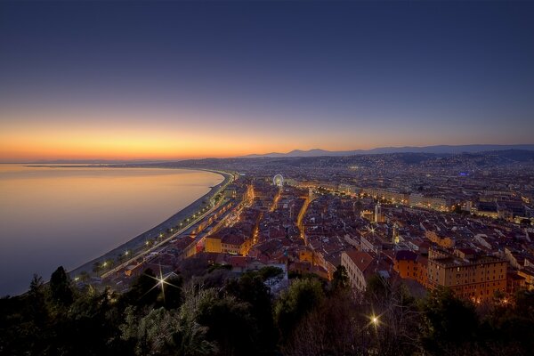 View of the city from a height. Beautiful sunset