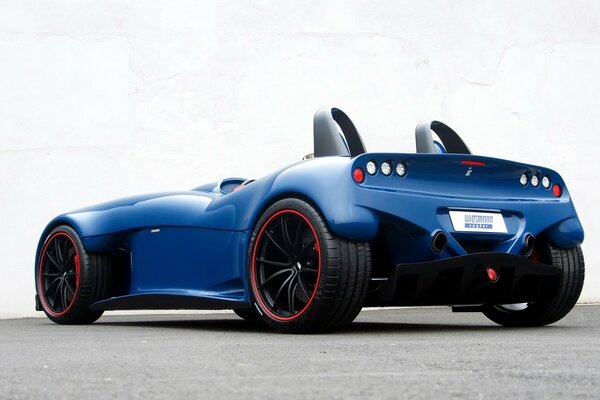 Blue racing sports car on a gray background