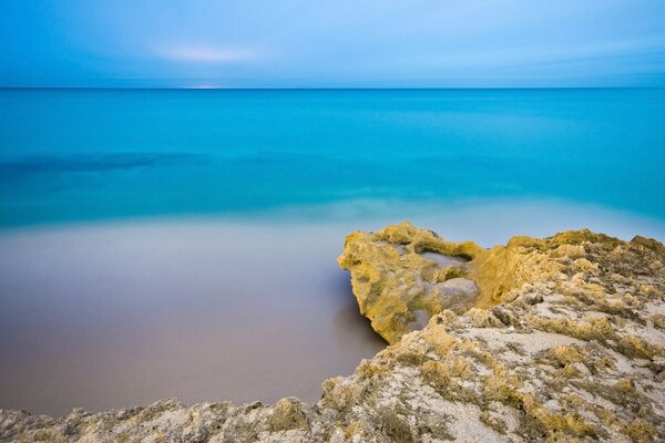 Sky blue sea with a clean sandy beach