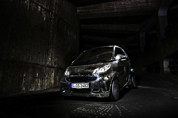 A car on the background of an abandoned hangar