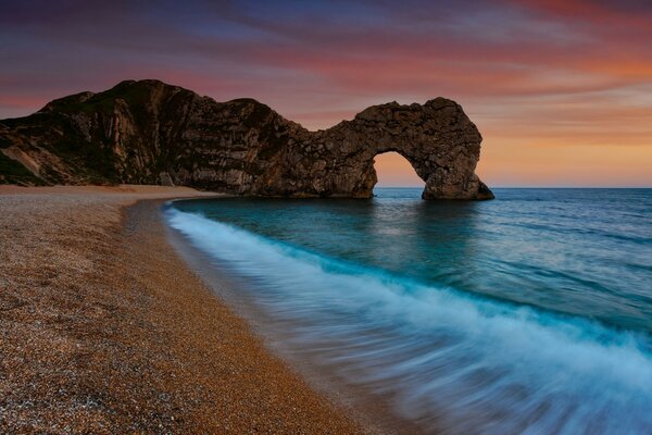 Arch-shaped rock on the seashore