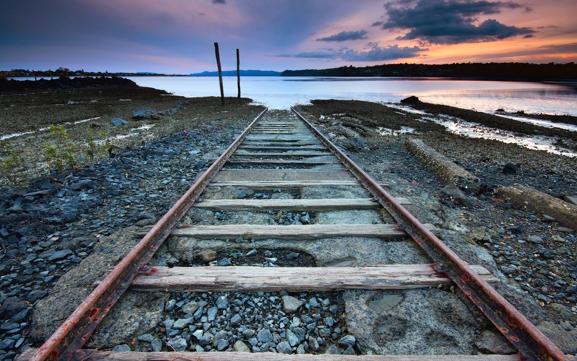 landscapes railway train track travel guidance transportation system sky gravel road water outdoors perspective line iron landscape steel vintage photo sea background nature view