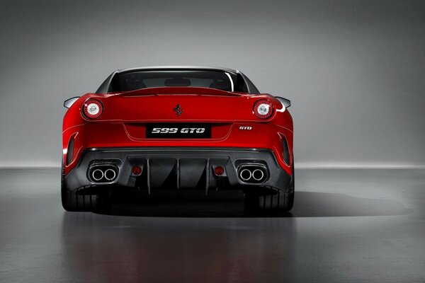 Bumper of a red Ferrari on a gray background