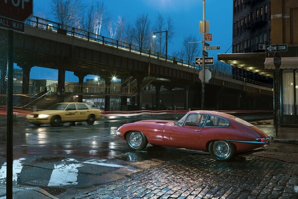 Coche viejo en la ciudad en la intersección