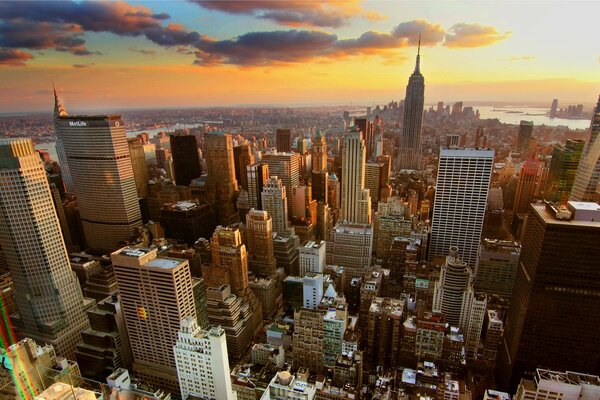 Colored sky over high-rise buildings