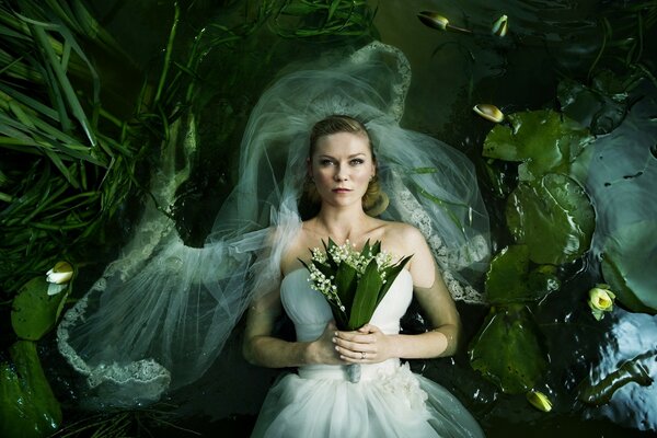 Bride with a bouquet on a green background