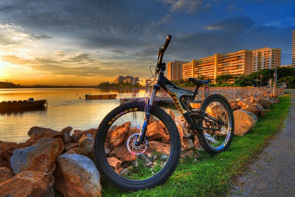 Bicycle on the background of a rocky shore