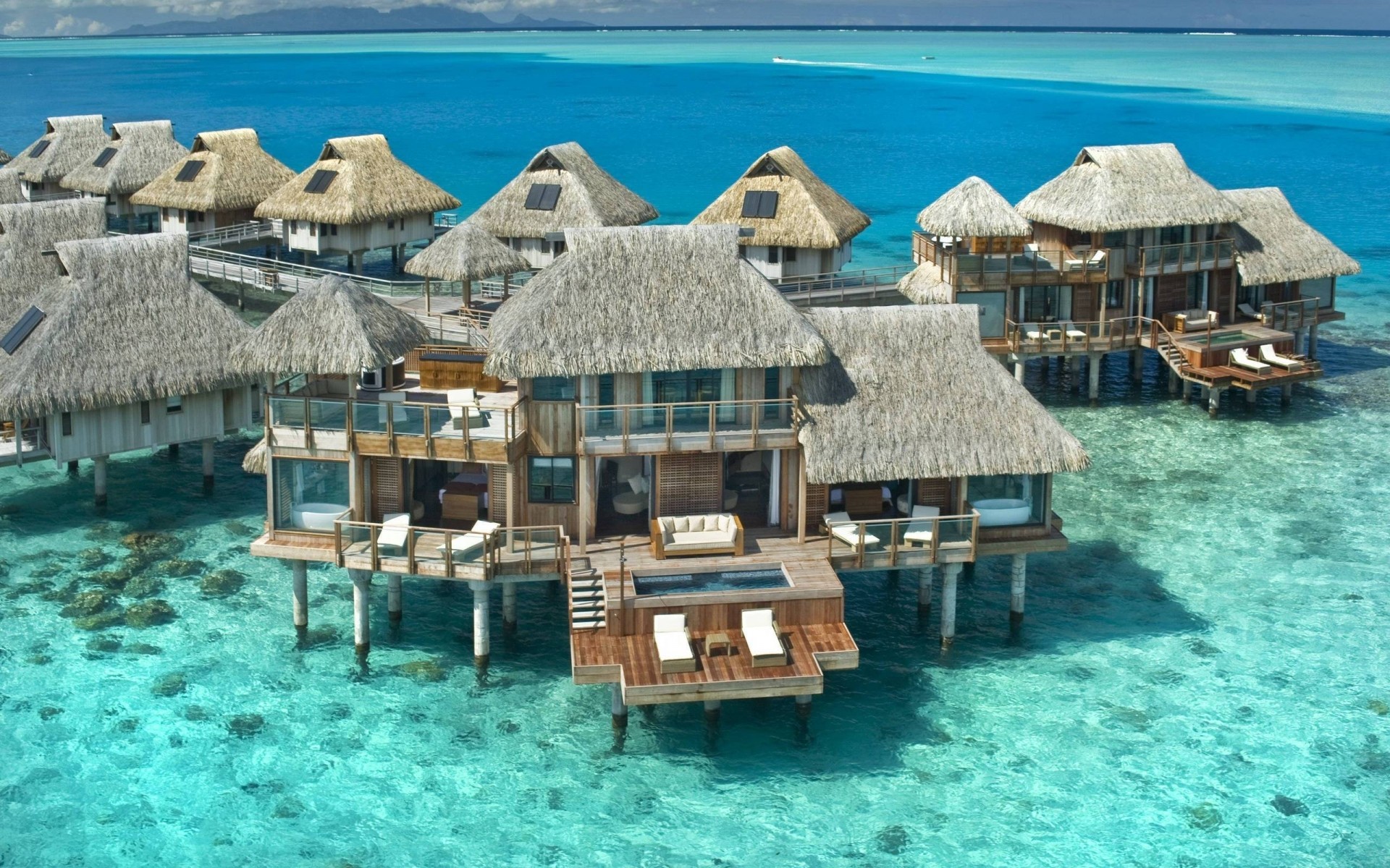 summer sea resort ocean water vacation travel tropical island seashore beach turquoise chair hotel bungalow paradise house exotic idyllic hut blue