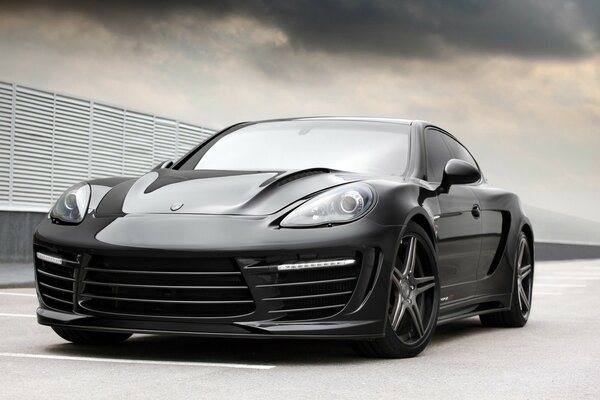 Black Porsche in the back of a coupe