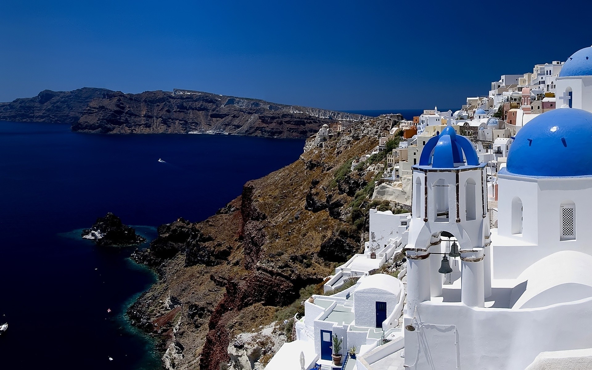 greece travel sea seashore architecture water caldera island outdoors ocean sky city watercraft town vacation